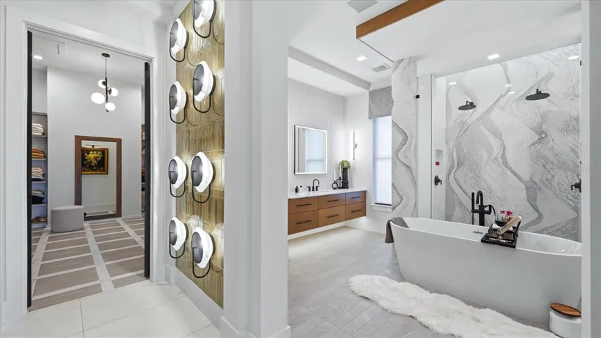 This primary suite has dual counters, luxurious soaking tub, walk-in 2-person shower with dual fixtures