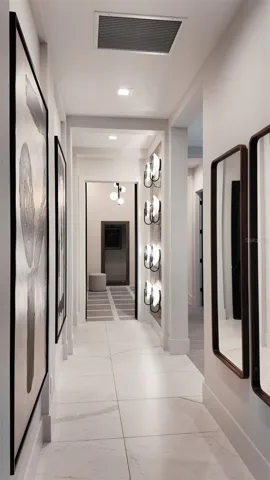 Spacious hallway connecting the primary suite's bedroom, en suite bath and walk-in closet