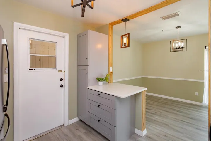 pantry, bar, and door to carport