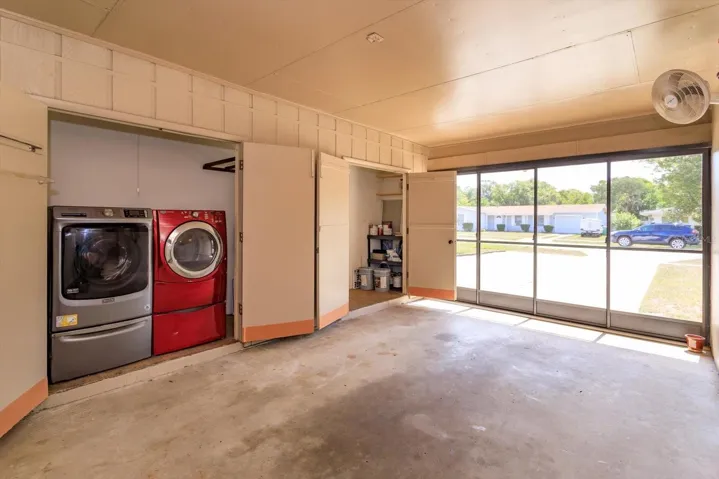 laundry closet and storage closet in carport