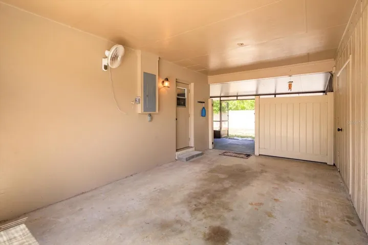 carport with gate onto screened lanai