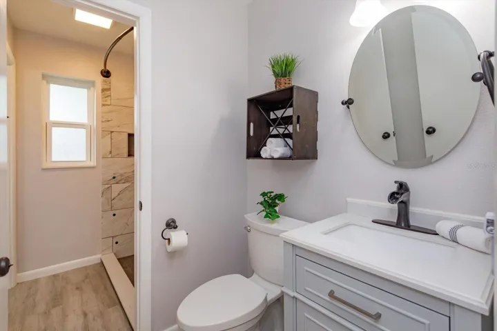 Half bath #2 from hallway looking into shared shower room