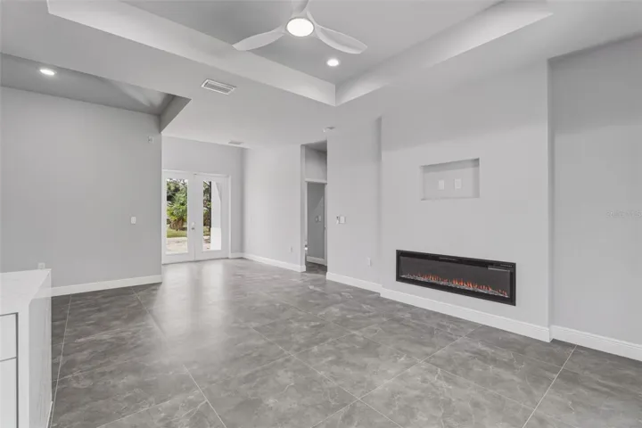 Fireplace and multiple trey ceilings