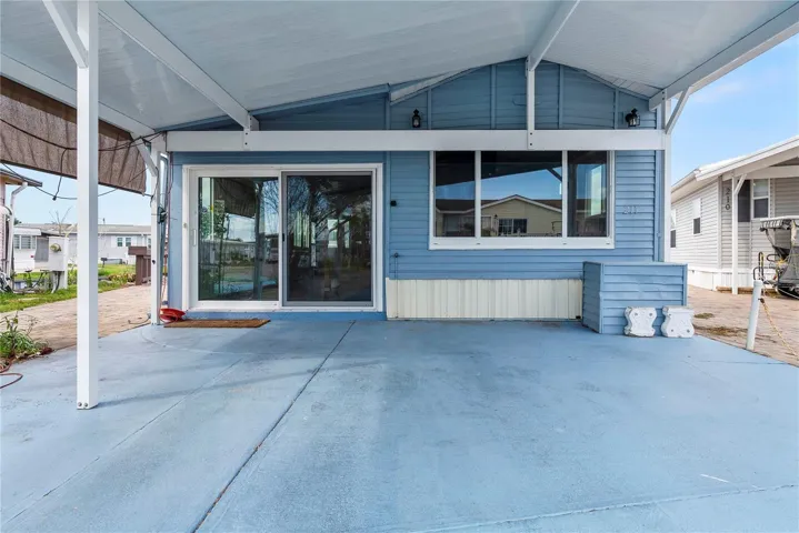 Covered car port welcomes you home and provides shade for you and your vehicle