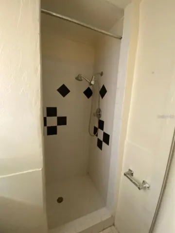 Shower stall in bathroom