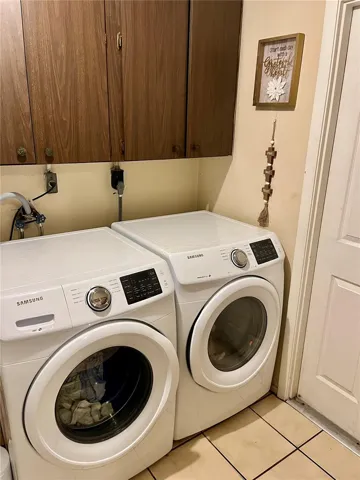 Large laundry room with utility sink