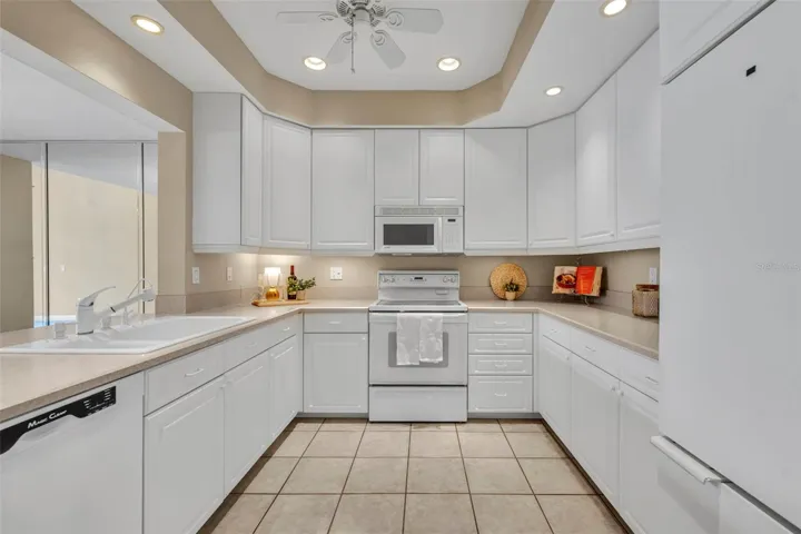 Ample cabinetry increases storage space in the kitchen.