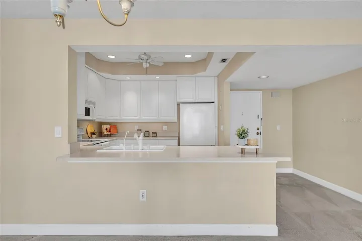 The kitchen footprint, generous in both counter and cabinet space, creates the perfect space for gourmet meals.
