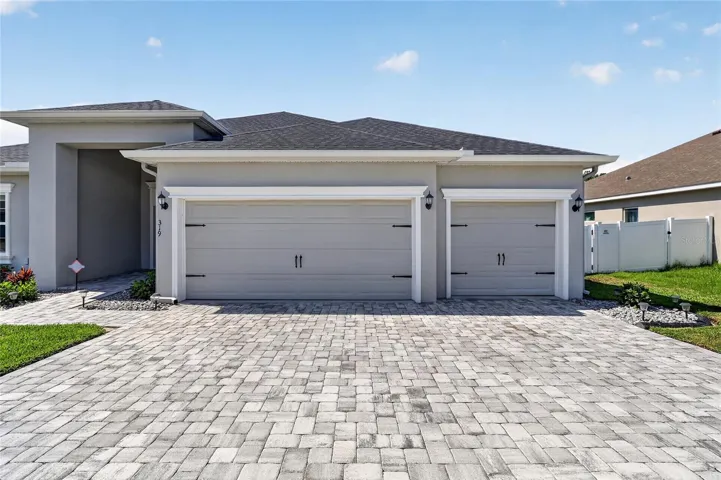 Spacious paved driveway with beautiful curb appeal.