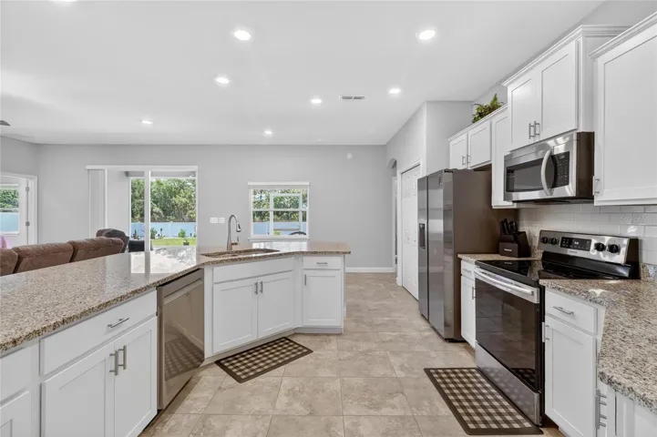 Stylish kitchen with crown molded cabinets