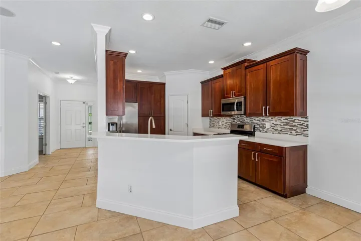 Open kitchen with stainless steel appliances