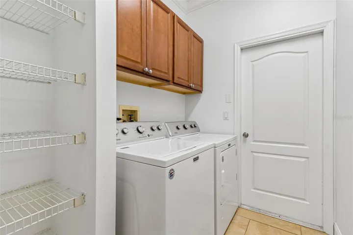 Laundry room with closet