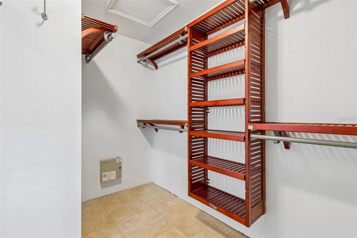 Primary walk in closet and custom shelving