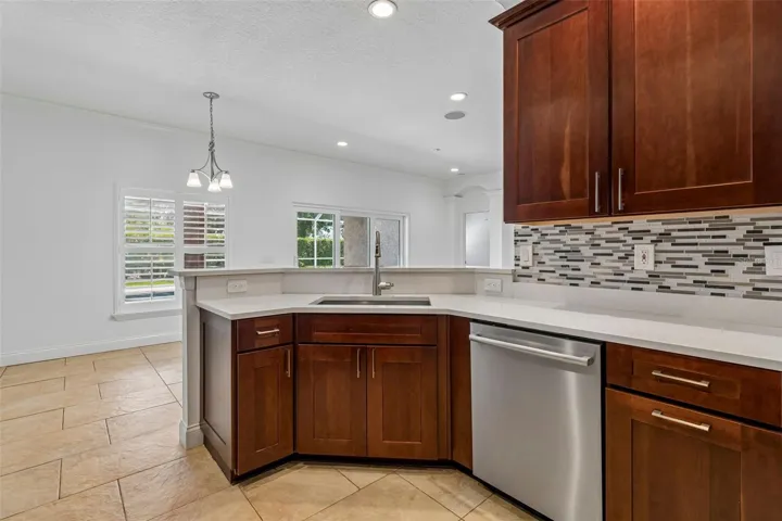 Open kitchen with stainless steel appliance