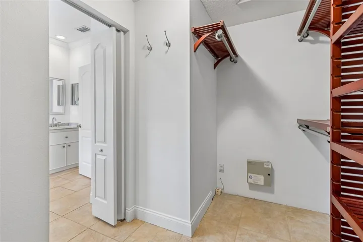Primary walk in closet and custom shelving