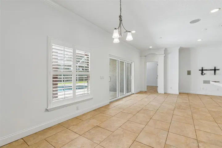 Great room/Breakfast nook overlooking pool and entrance to primary suite