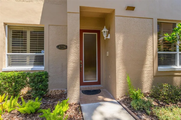 Private front door on this 2/2 Palm Harbor condo with a garage!