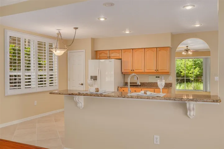 Breakfast bar and eat-in area in this nicely-sized kitchen with new appliances!