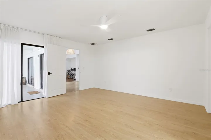 Primary  Bedroom with Sliding Door Leading to Lanai
