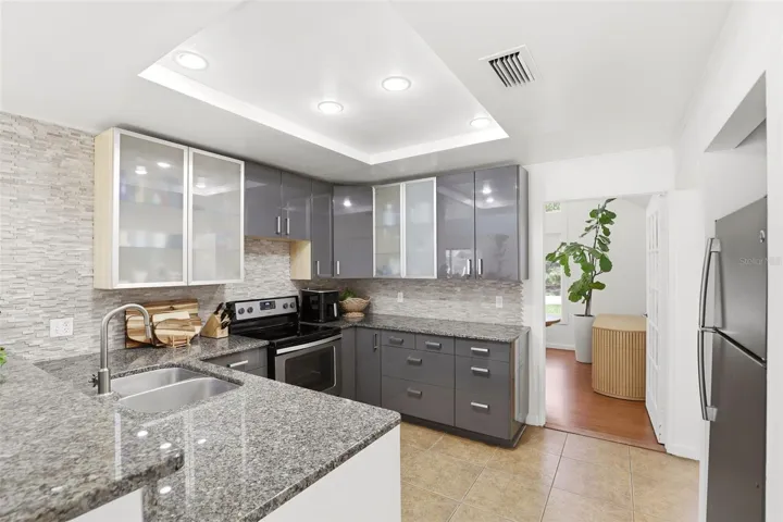 Kitchen with Breakfast Bar and Recessed Lighting