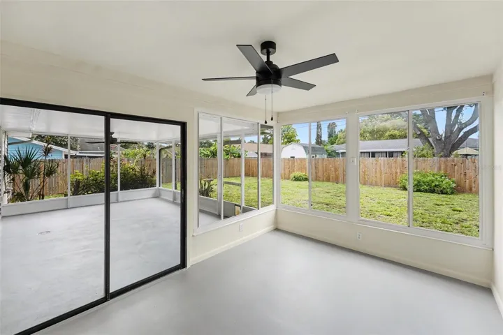 Florida Room Looks Out To Screened-In Patio