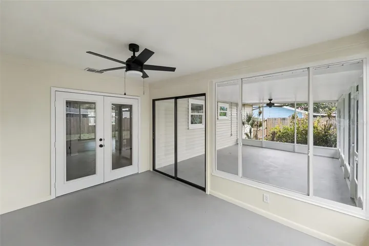 Florida Room Looks Out To Screened-In Patio