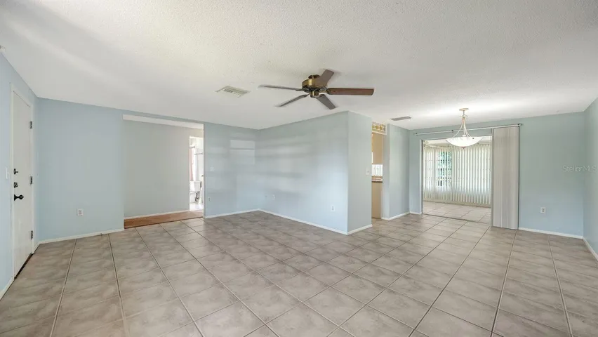 Un-staged Living & Dining Rooms