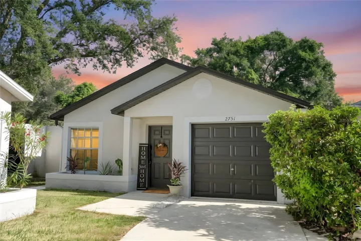 Charming Palm Harbor home featuring excellent curb appeal,  3 Bedrooms, 2 Bathrooms, a one-car garage, and a welcoming front entry.