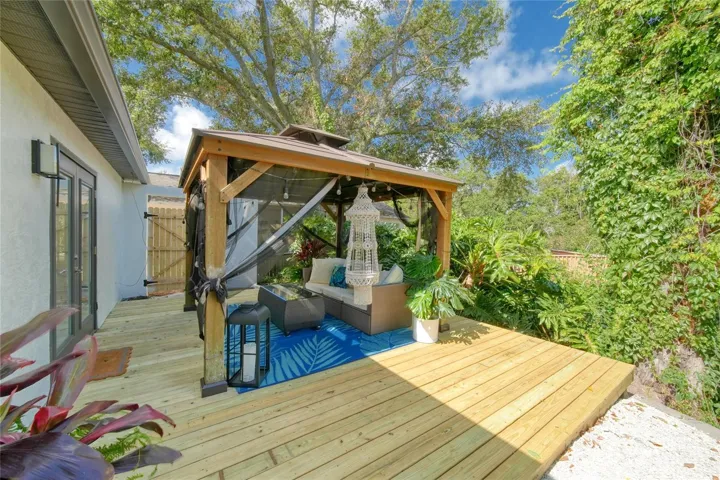 Whether you're entertaining friends or unwinding after a long day, this outdoor space is designed to be enjoyed year-round.