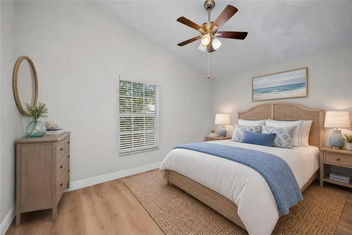 Virtually Staged - Spacious primary bedroom with plenty of room for a king-size bed and additional furnishings.