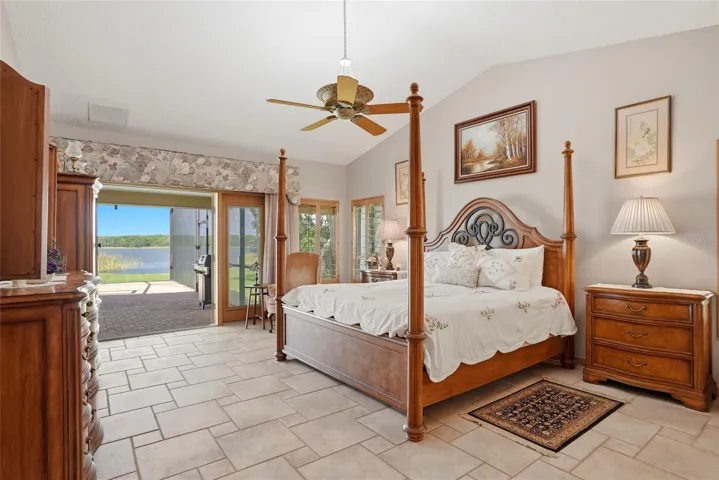 Primary Bedroom withhurricane impact rated Frenchdoors to the enclosed pool.Start every morning withstunning views of the lake.
