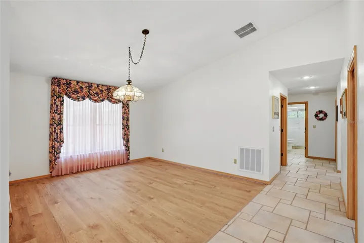 Dining room, to the right arebathroom 2 and bedrooms 2and 3, both with stunning lakeviews