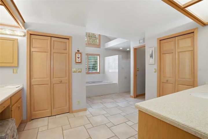 Primary Bathroom ensuite withdual walk in closets andcustom built ins