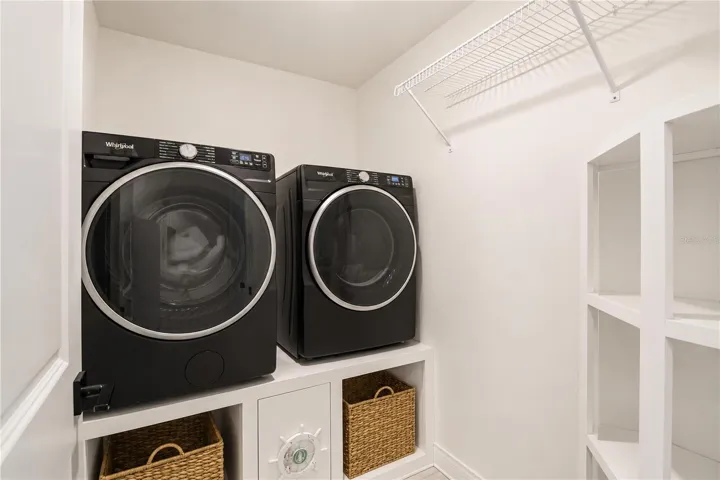 Custom built-in pedestals with storage below for your washer and dryer.