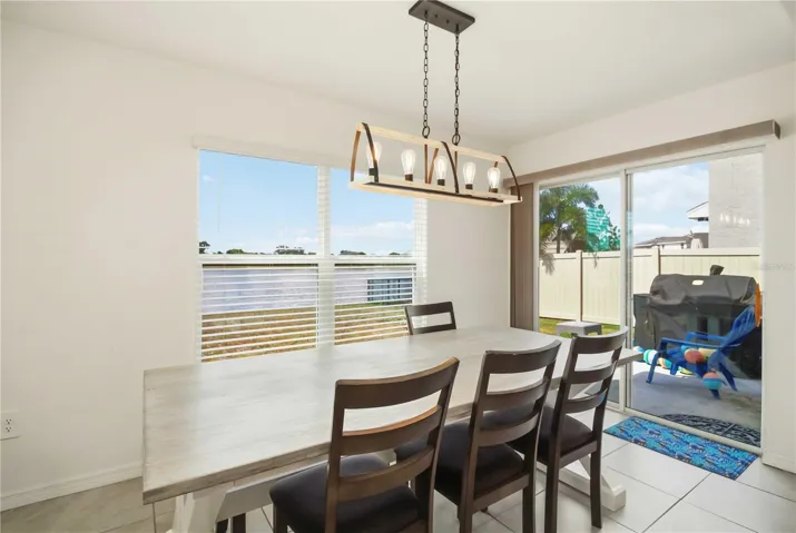 Bright open concept dining room with natural light and modern finishes.