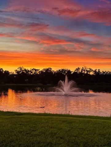 Sunsets hit different when they're yours. Pond-view lot with fountain views