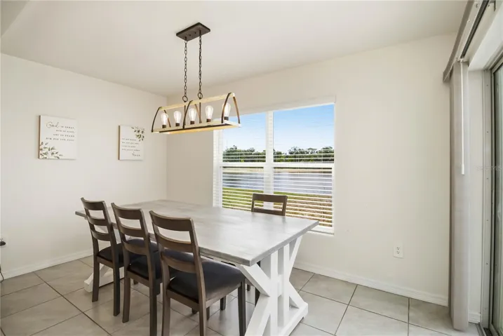 Bright open concept dining room with natural light and modern finishes.
