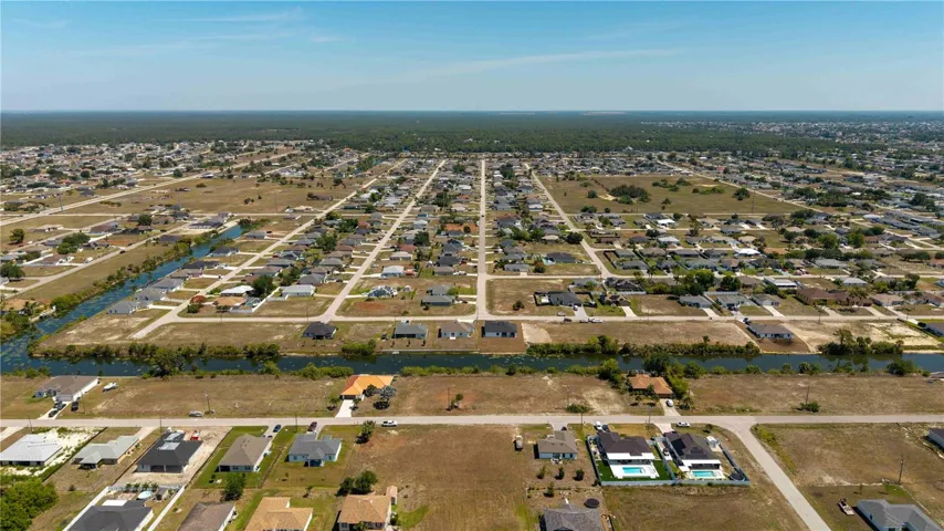 Perfectly situated for BUILDING A CUSTOM HOME, this SPACIOUS PROPERTY measures 120 feet by 126 feet, providing a generous 14,985 sq ft OF LAND TO BRING YOUR VISION TO LIFE INCLUDING THAT OVERSIZED CIRCULAR DRIVEWAY!