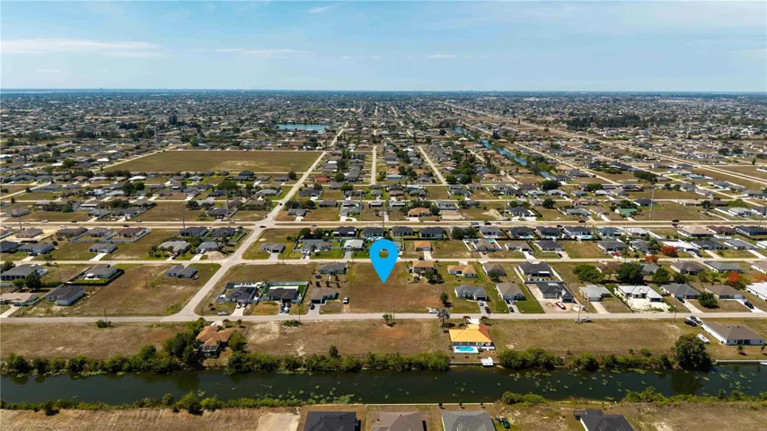 This 0.34-acre VACANT RESIDENTIAL LOT in NE CAPE CORAL offers an EXCEPTIONAL OPPORTUNITY TO CREATE YOUR IDEAL LIVING SPACE!