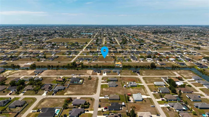 Perfectly situated for BUILDING A CUSTOM HOME, this SPACIOUS PROPERTY measures 120 feet by 126 feet, providing a generous 14,985 sq ft OF LAND TO BRING YOUR VISION TO LIFE INCLUDING THAT OVERSIZED CIRCULAR DRIVEWAY!