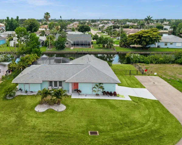 Welcome to 2102 SE 8th St on a huge corner waterfront lot
