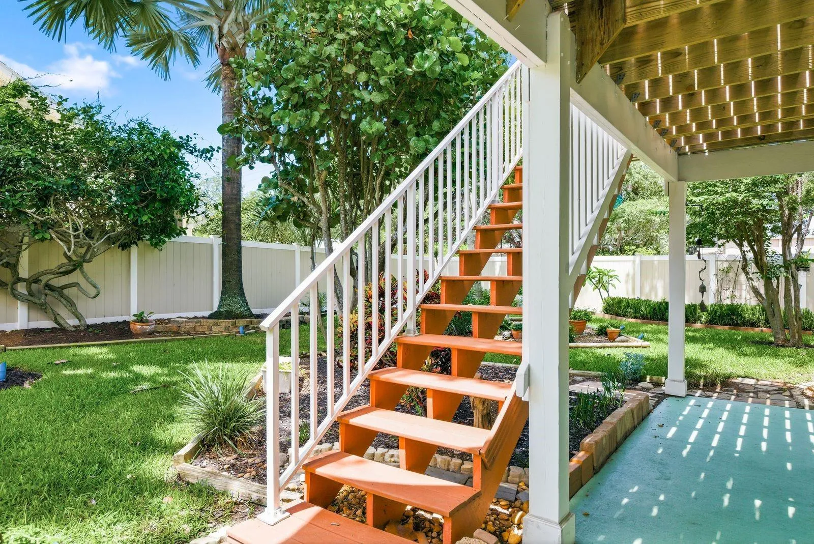 Newly rebuilt trex stairs from upstairs deck to backyard/downstairs patio.