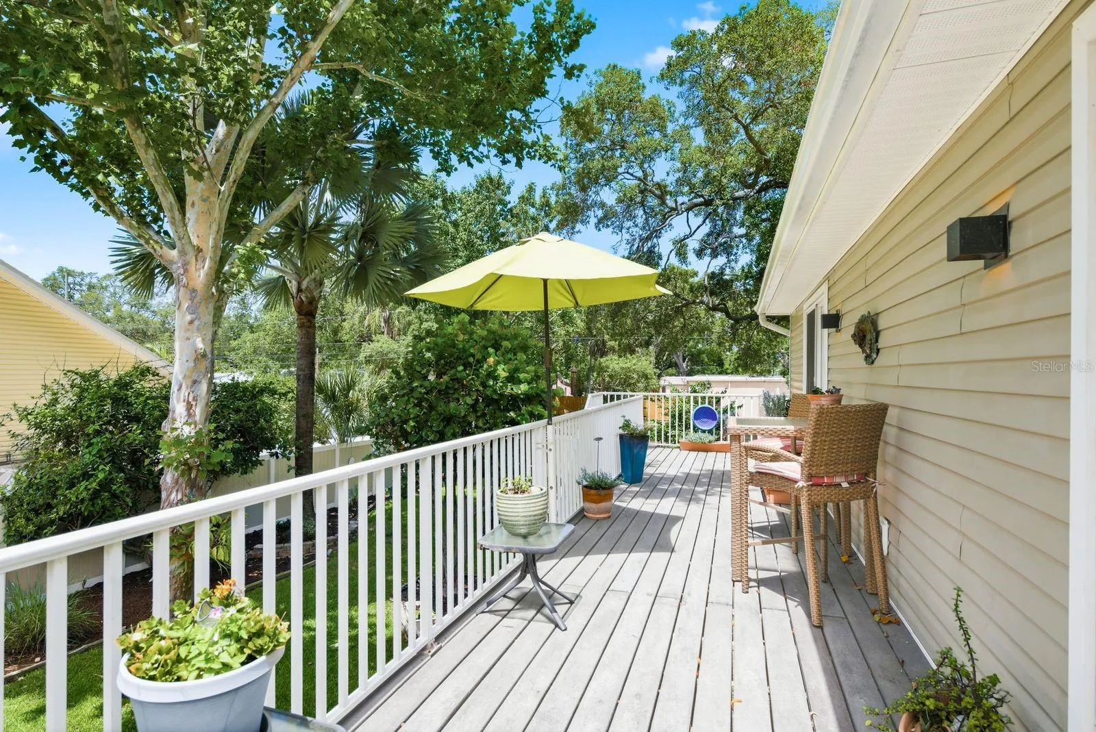 Trex upstairs deck overlooking beautifully landscaped backyard.