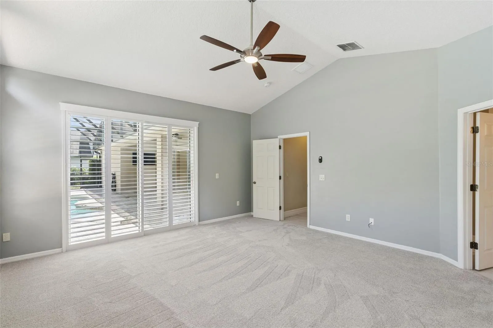 PRIMARY BEDROOM WITH POOL VIEW