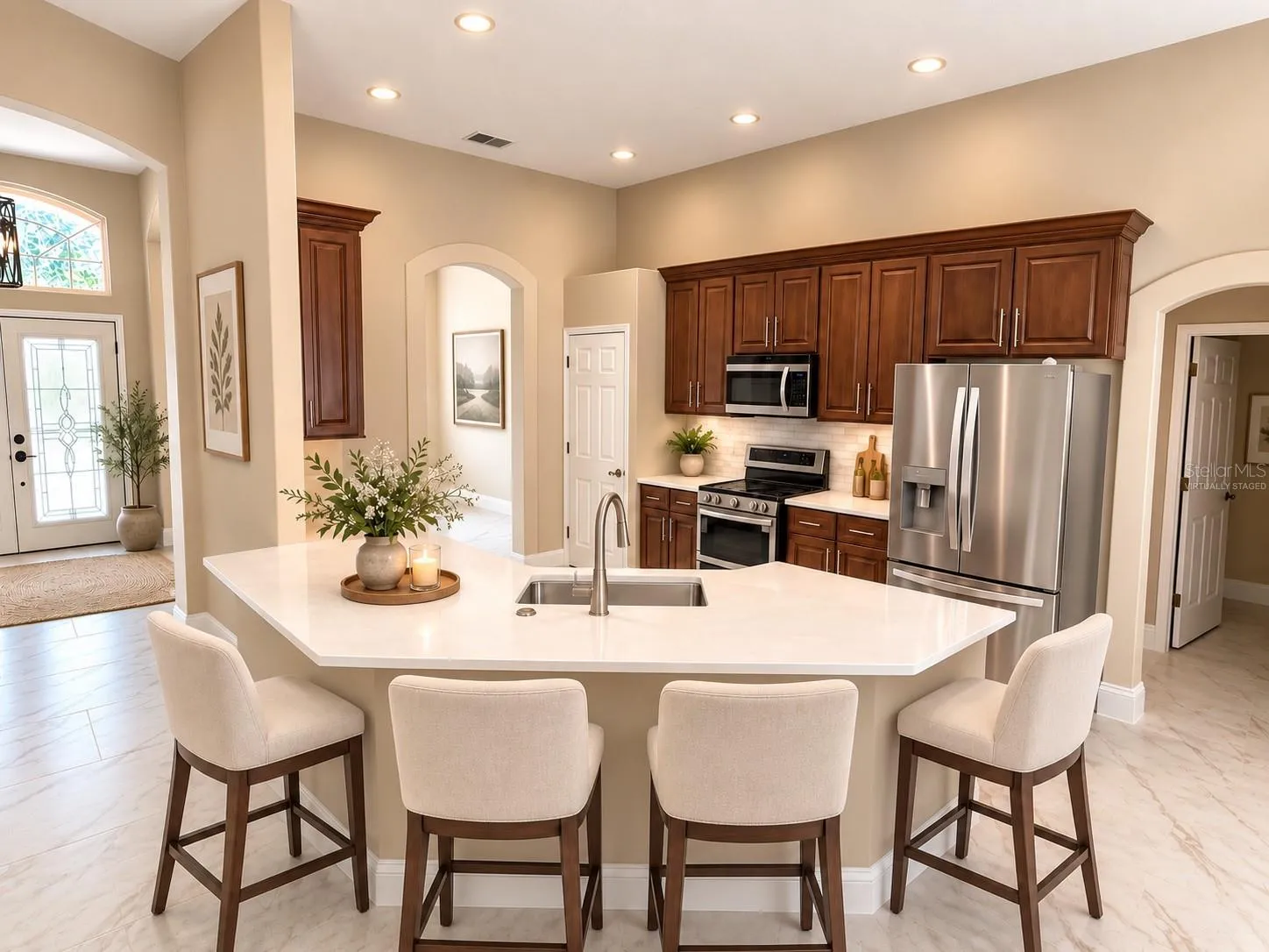 This photo has been virtually staged.  The kitchen now has a one level countertop/breakfast bar and the new backsplash