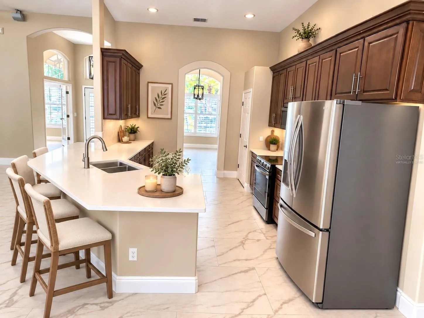 This photo has been virtually staged.  View of kitchen looking toward the dining room at the front of the house.