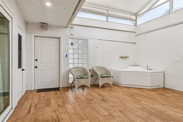 One of the home's most unique features is the spectacular BONUS ROOM/CONSERVATORY, a light-filled retreat complete with a SPA AND TANKLESS WATER HEATER (2021).