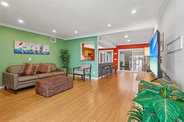 The CONVENIENT PASS-THROUGH WINDOW creates a seamless connection from the Kitchen to the Living Room.