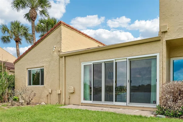 Step through the sliding glass doors and enjoy the beautiful view of Lake Howell.