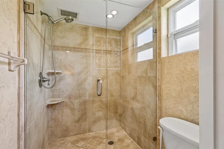 Relax at the end of your day in an EN SUITE BATH with dual sinks and a step-in shower.